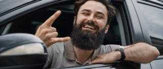 close up side portrait happy man driving car