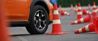 close up wheel orange car road