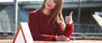 young beautiful happy woman posing near training car