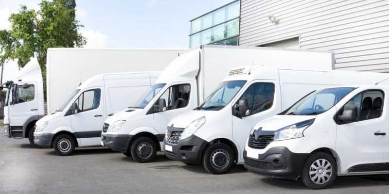 several vans trucks parked parking lot rent